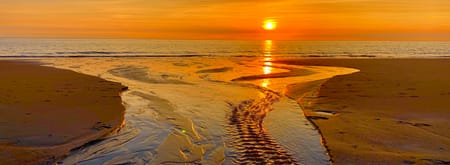 Zonsondergang op het strand Zonsondergang op het strand