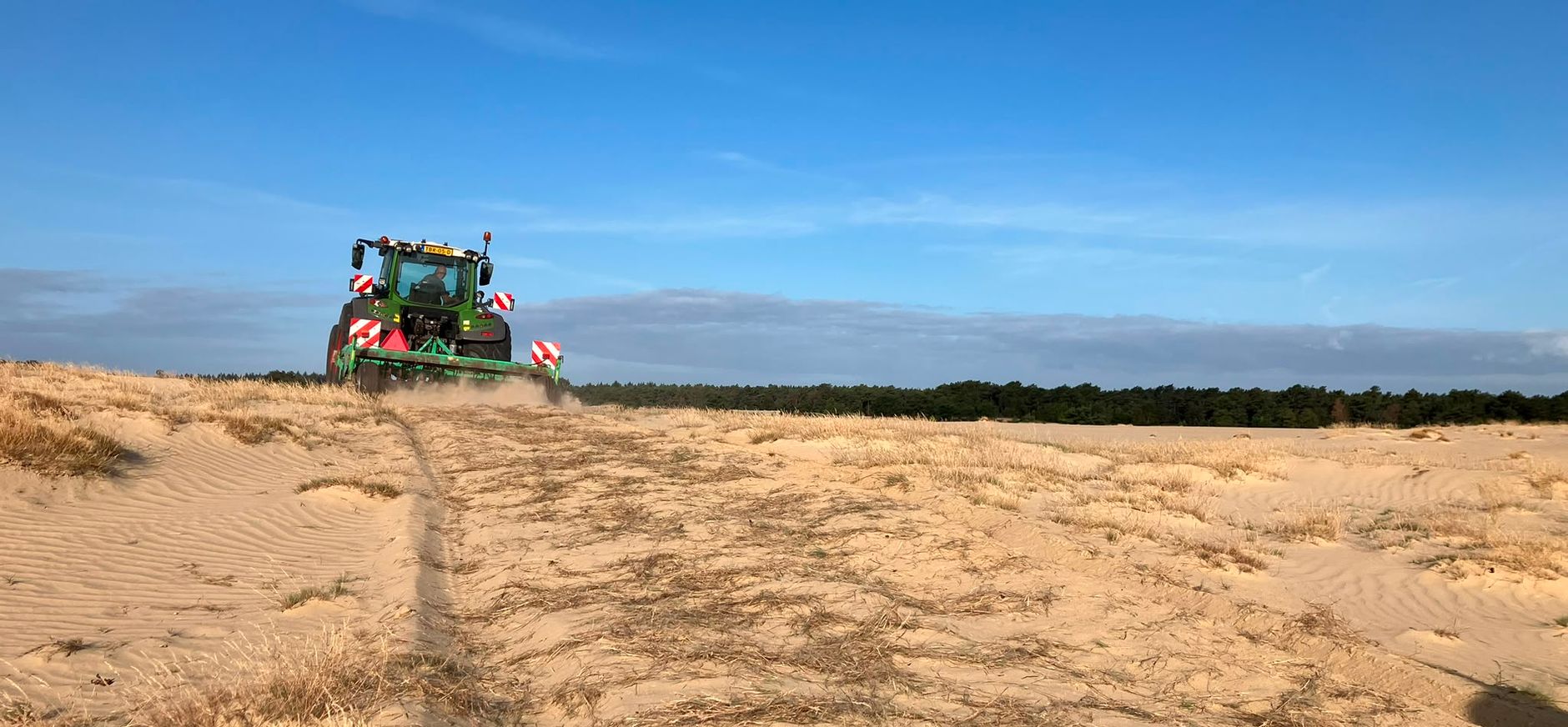 tractor met Kvik machine