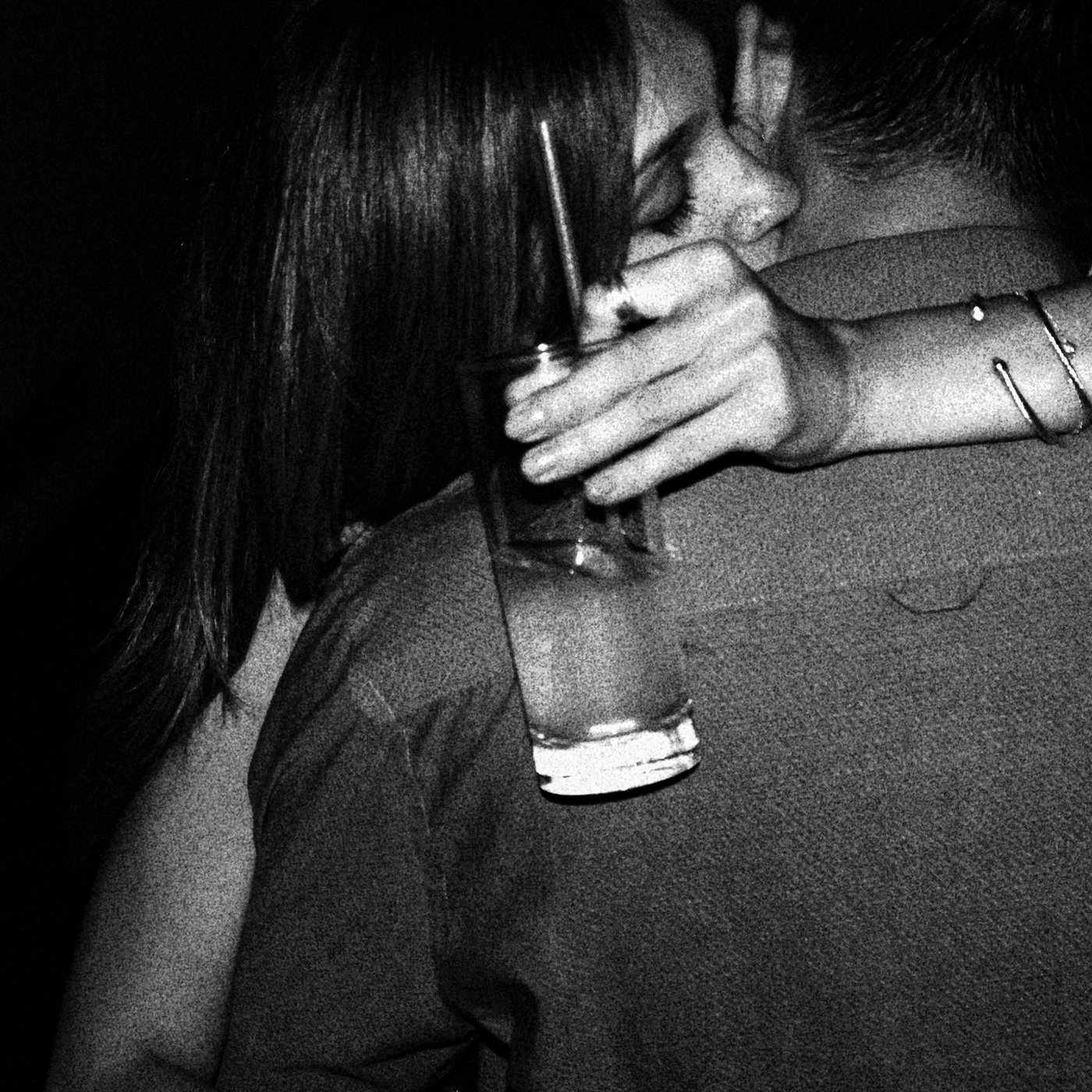 Couple hugging in club