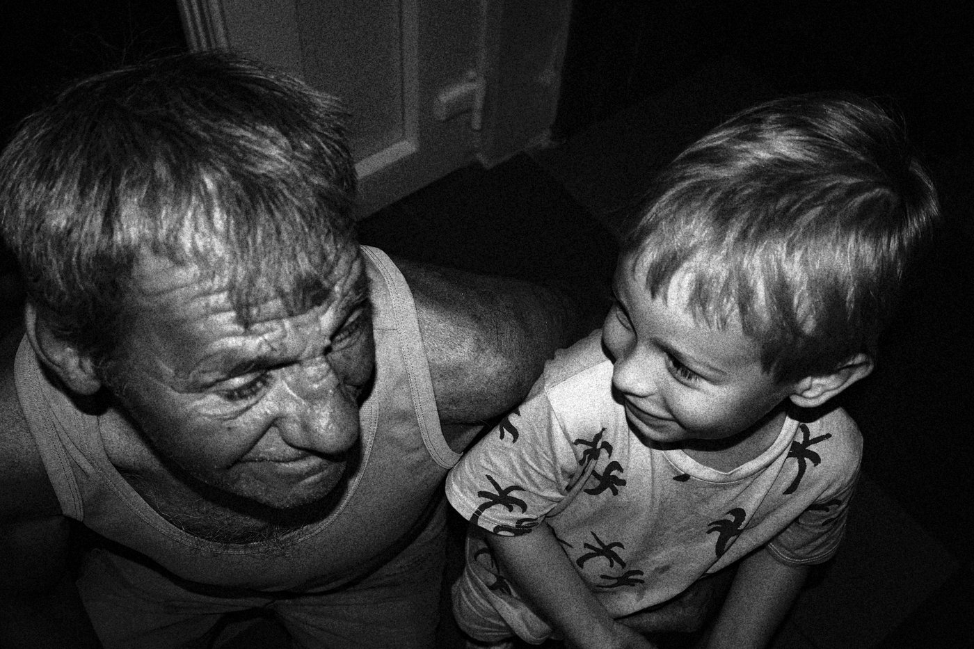 and old man next to a young boy