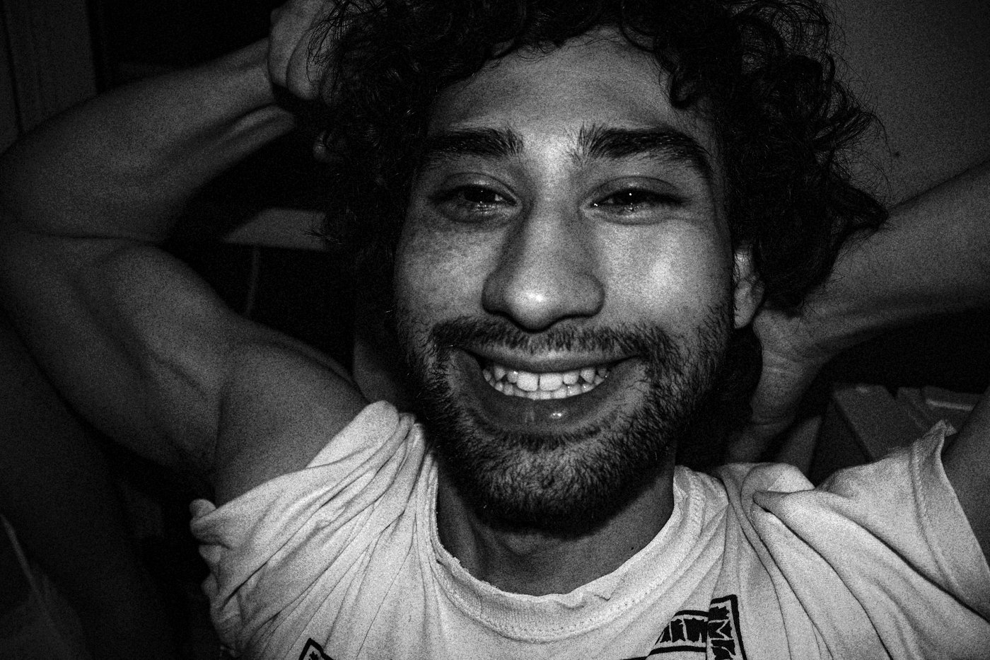 man smiling and flexing