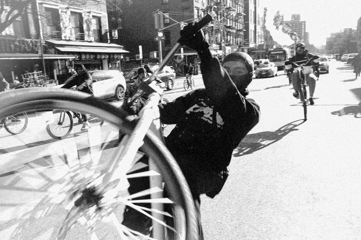 Man doing wheelie on bike