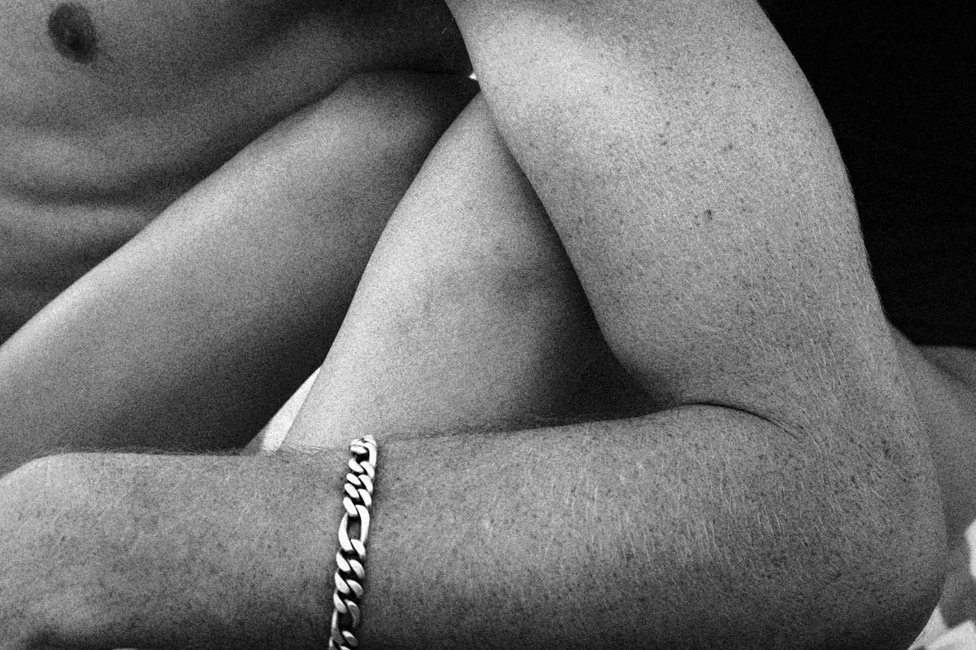 the arm and leg of man and woman