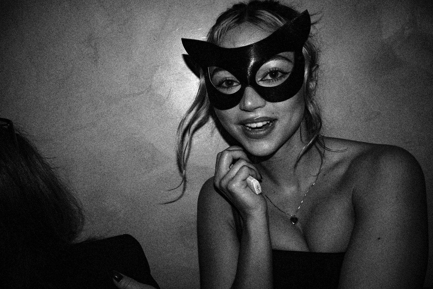 Woman in party wearing mask