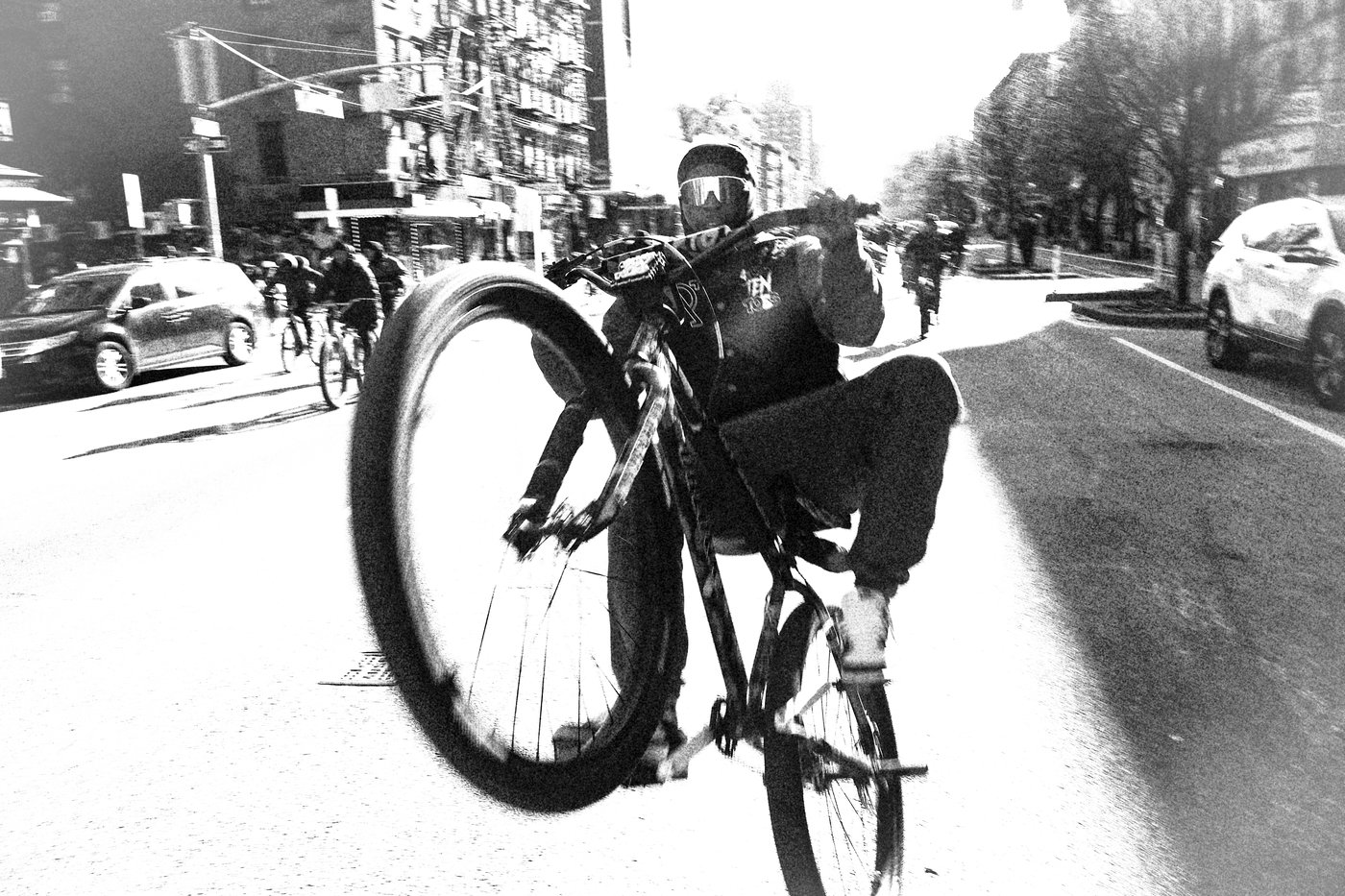 Man doing wheelie on bike