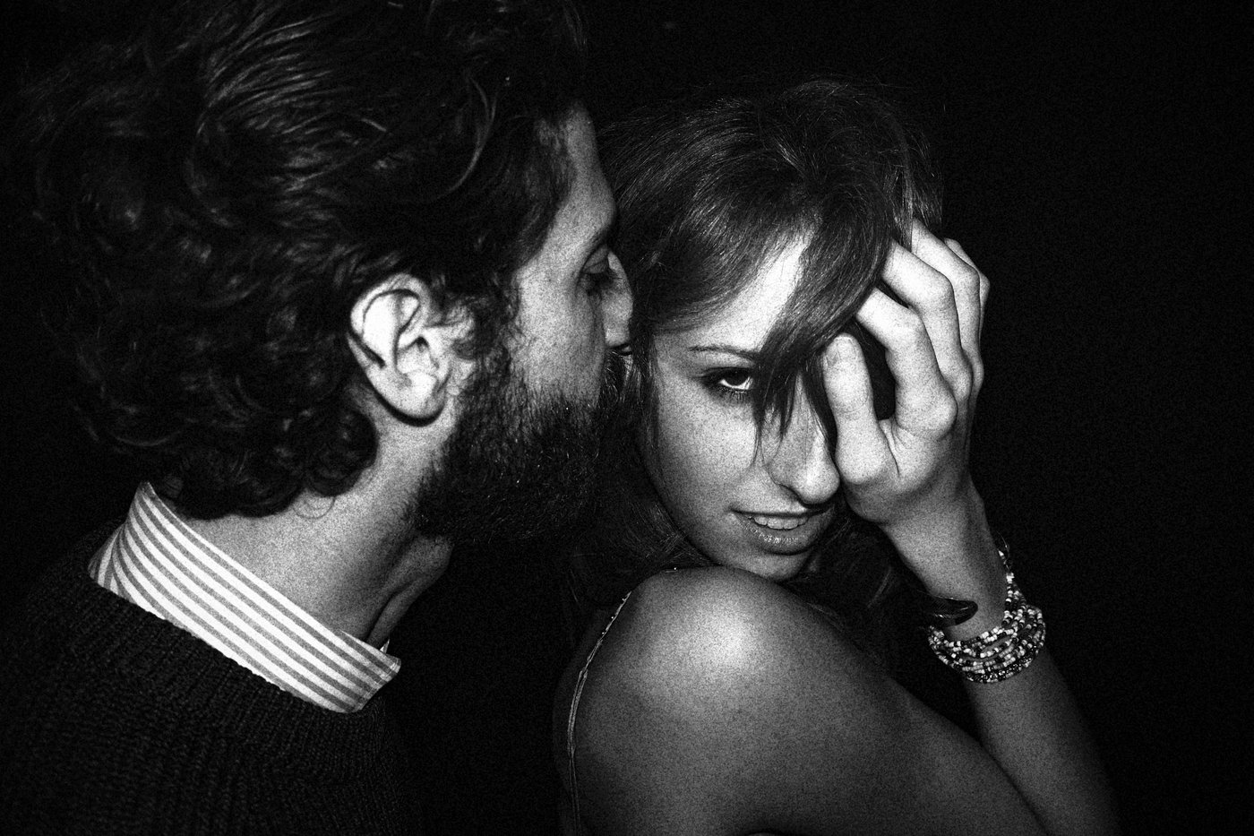 Couple in a club embracing 