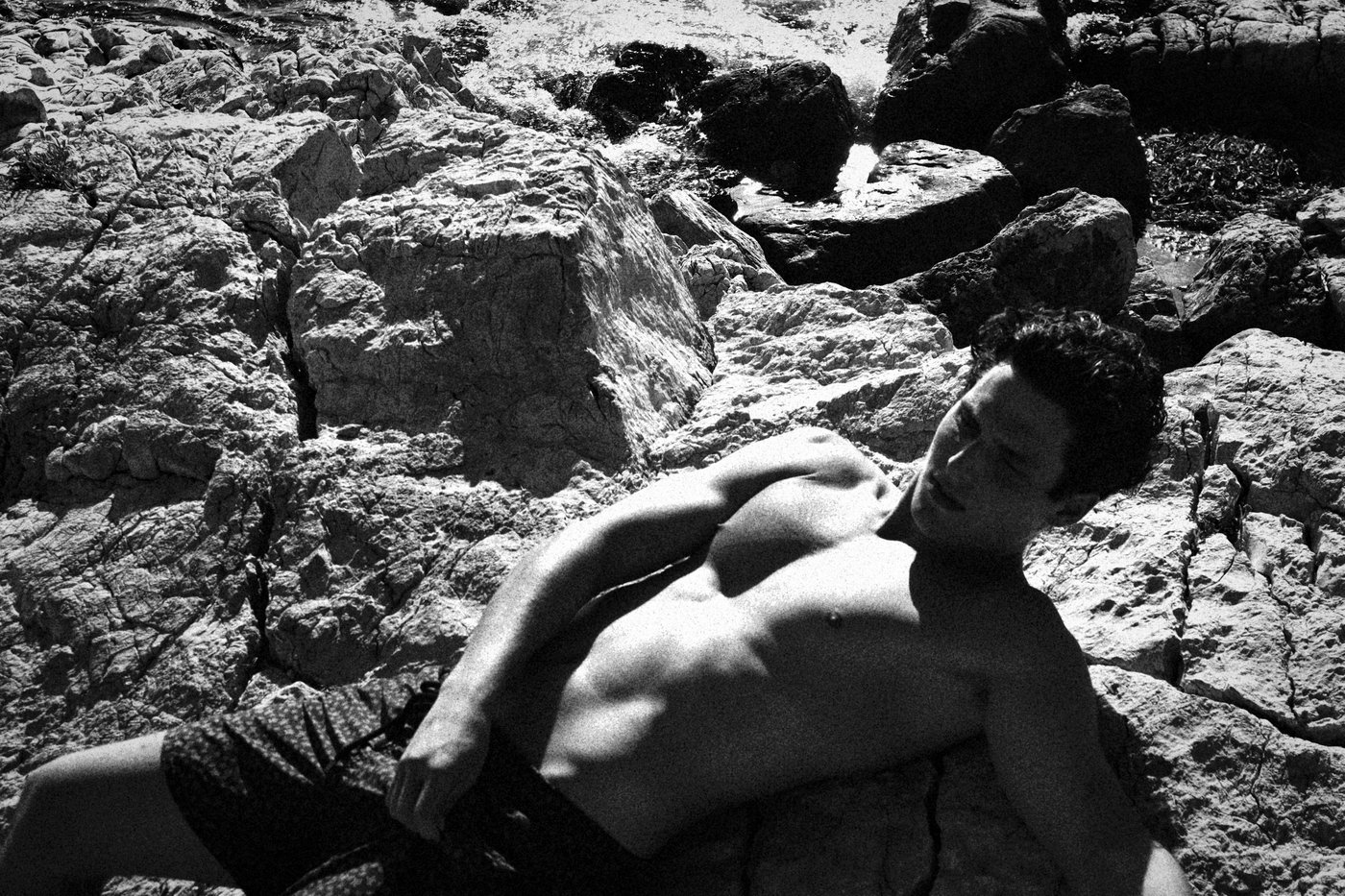 Charlie coming out of the water shirtless