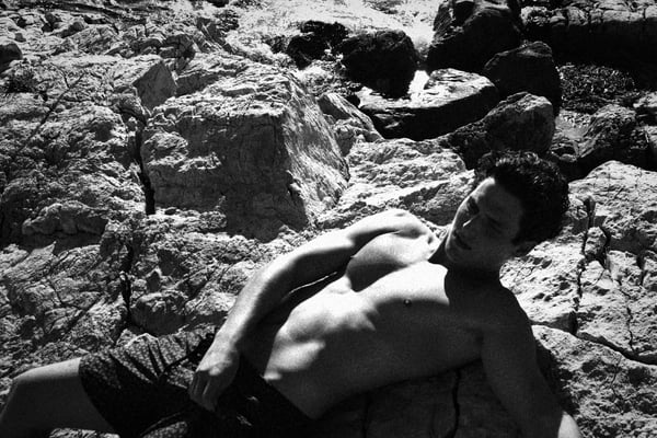 Charlie coming out of the water shirtless