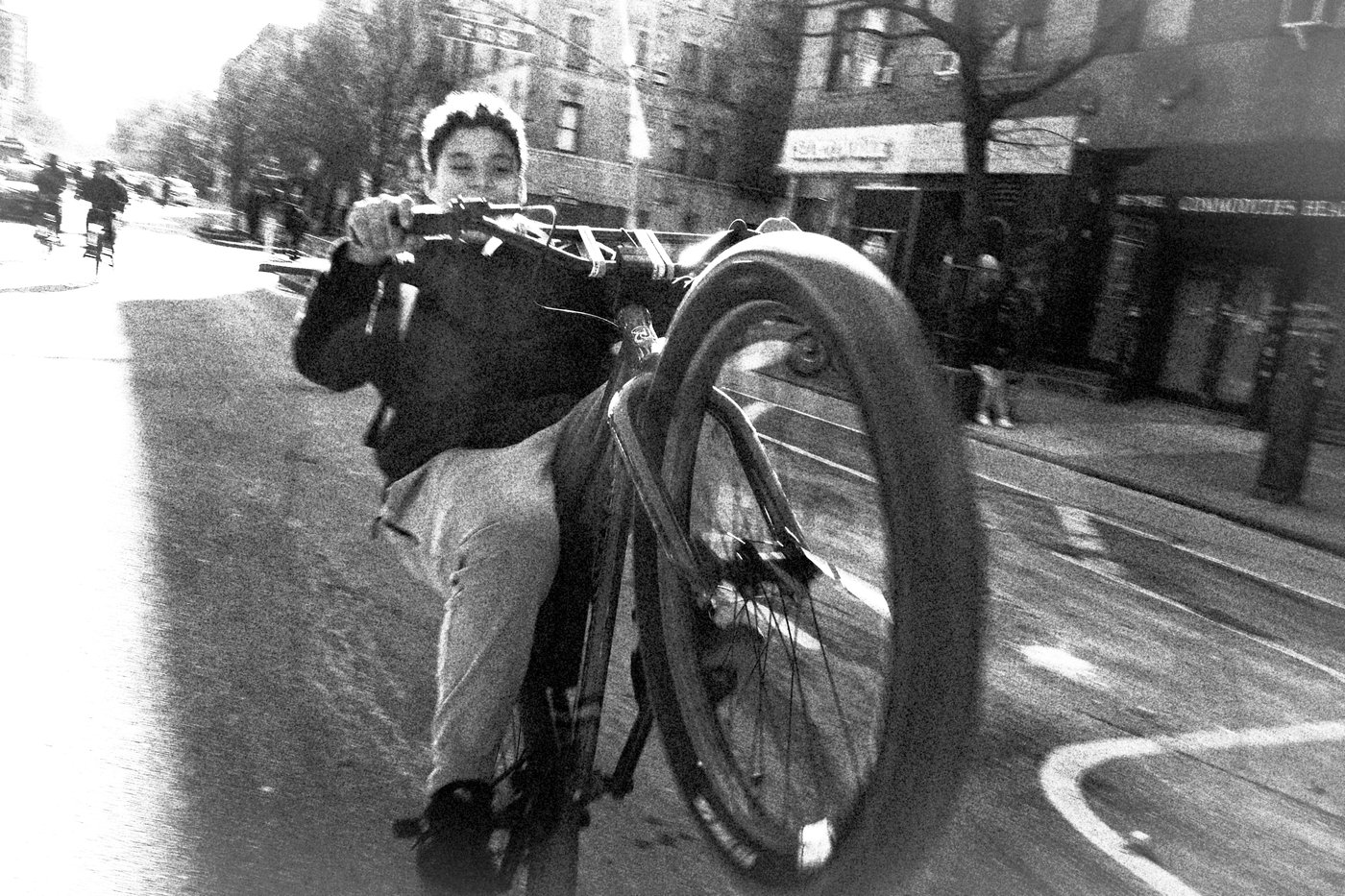 Man doing wheelie on bike