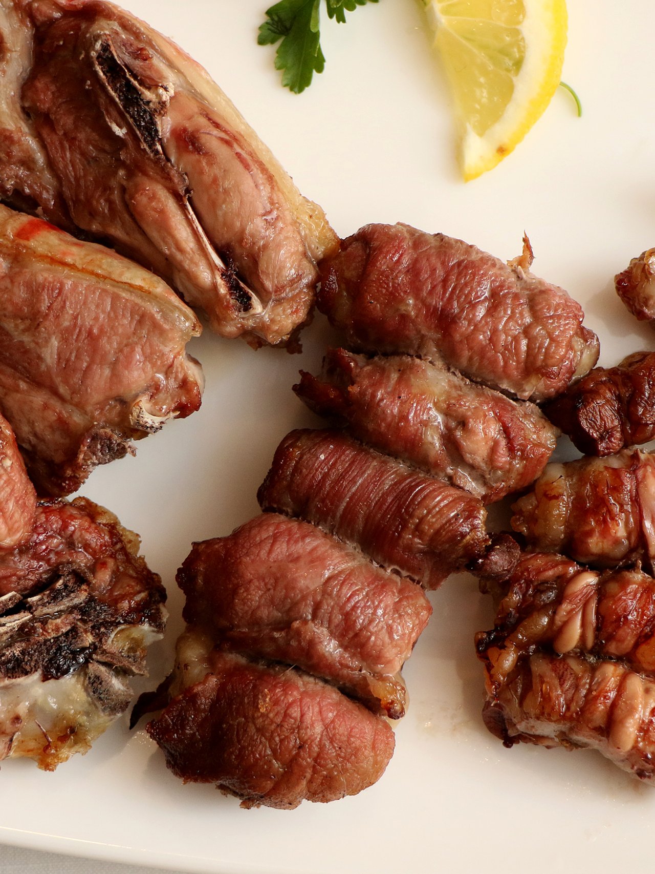 Traditional meats from Puglia, Italy served on a platter.