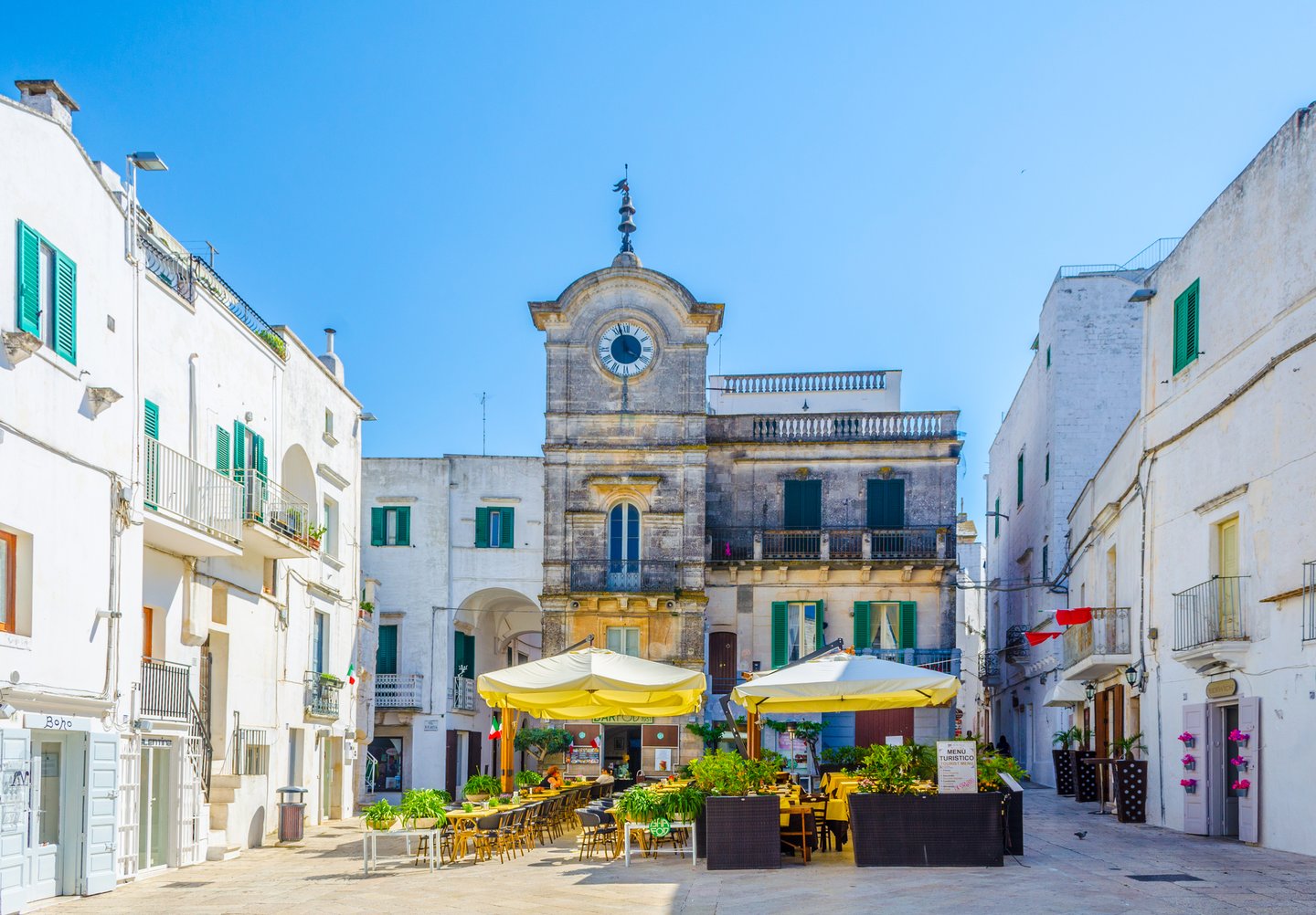 A small square in Cisternino, Italy on a sunny day.