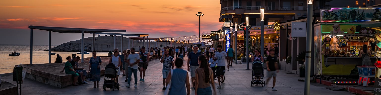 People walking along the promenade on a summer evening in Durres, Albania