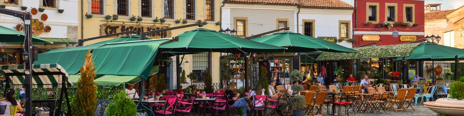 People hanging out at cafes at the Old Bazaar of Korca