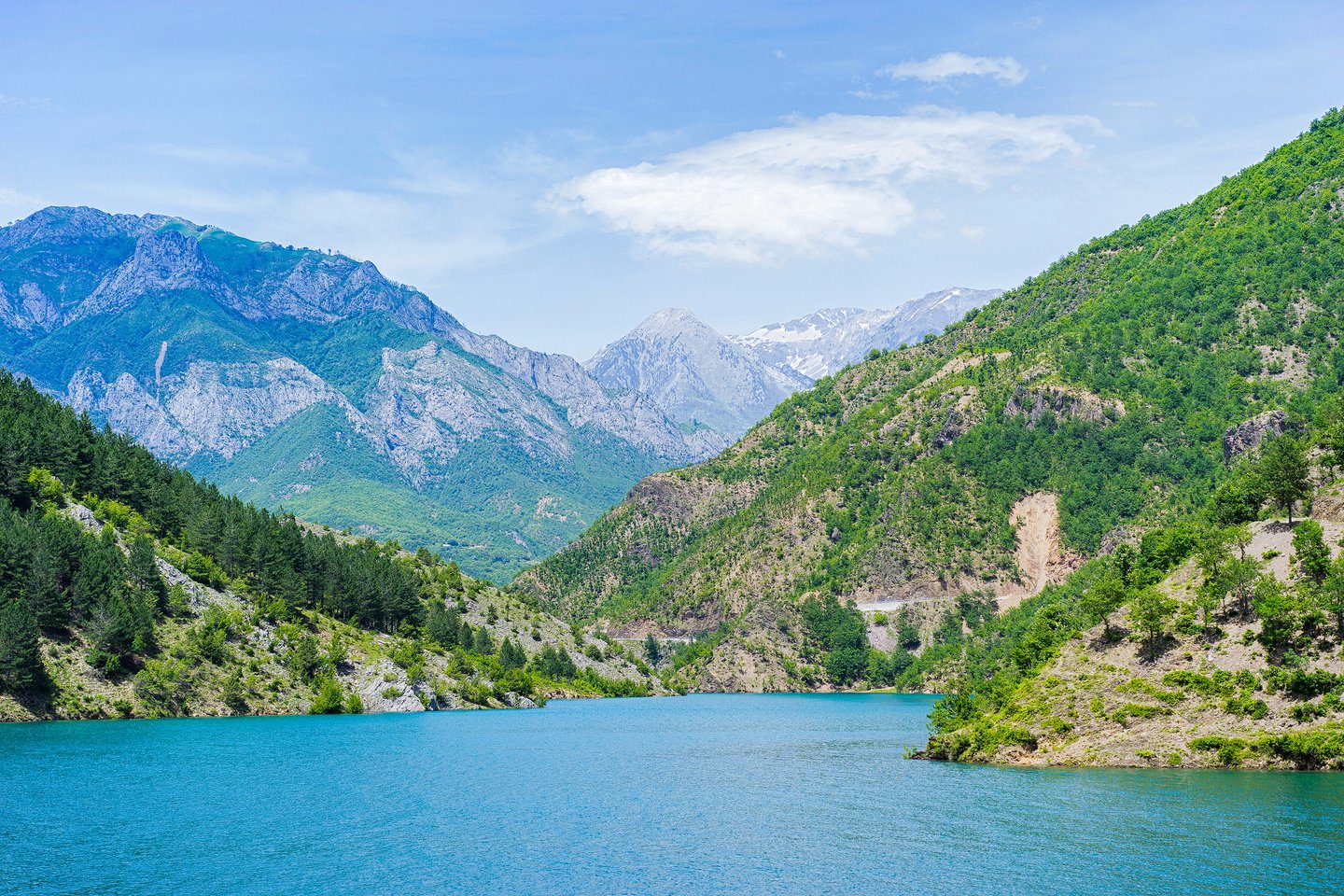 Lake Koman surrounded by mountains in Northern Albania in the summer