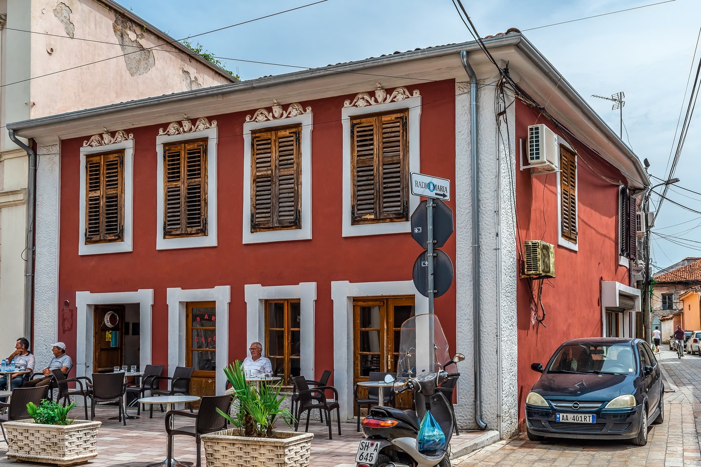 Men sitting outside a coffe shop in Shkoder, Albania
