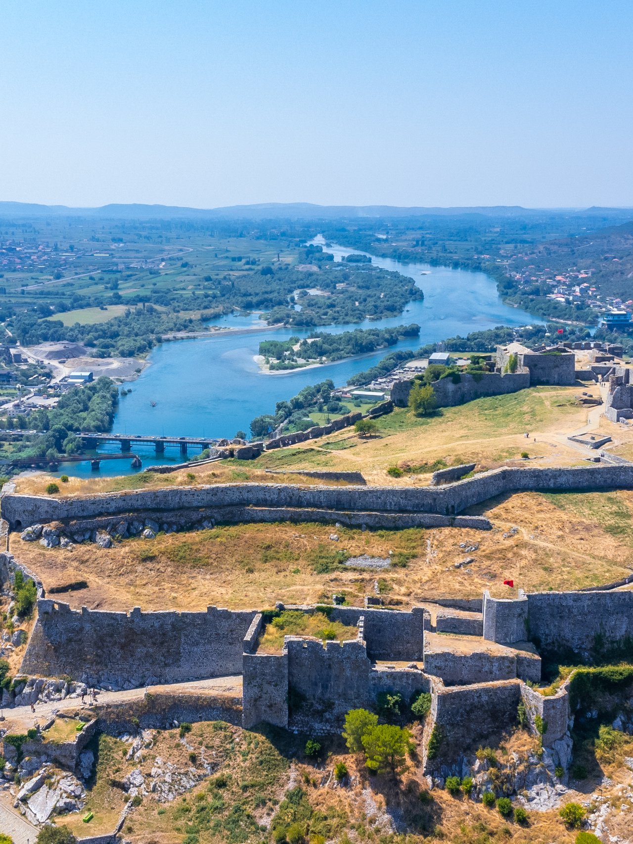 An aerial view of Rozafa Castle overlooking the lake and the river in Albania