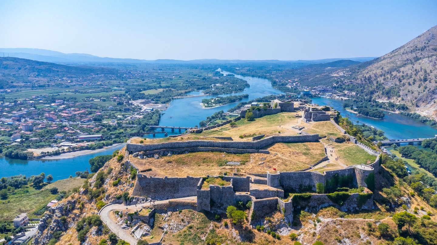 An aerial view of Rozafa Castle overlooking the lake and the river in Albania