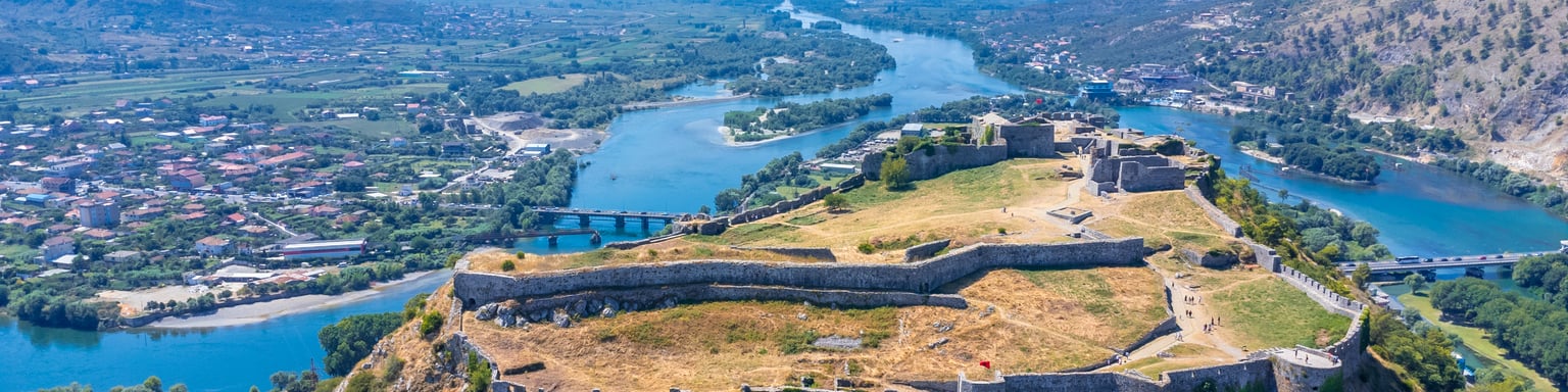 An aerial view of Rozafa Castle overlooking the lake and the river in Albania