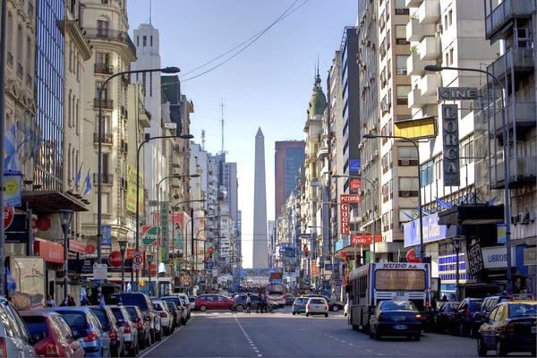 A streetscape of Buenos Aires with the Argentinian obelisk in the background