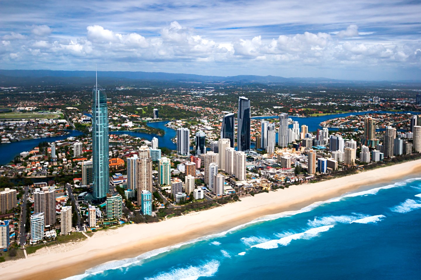 An aerial view of buildings and the beach in the Gold Coast, Australia.
