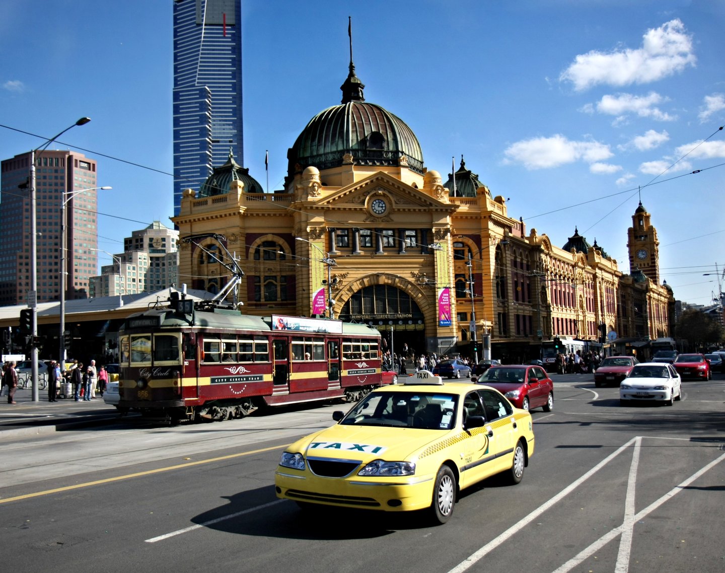 Cars and a tram outside Flinders Station in Melbourne