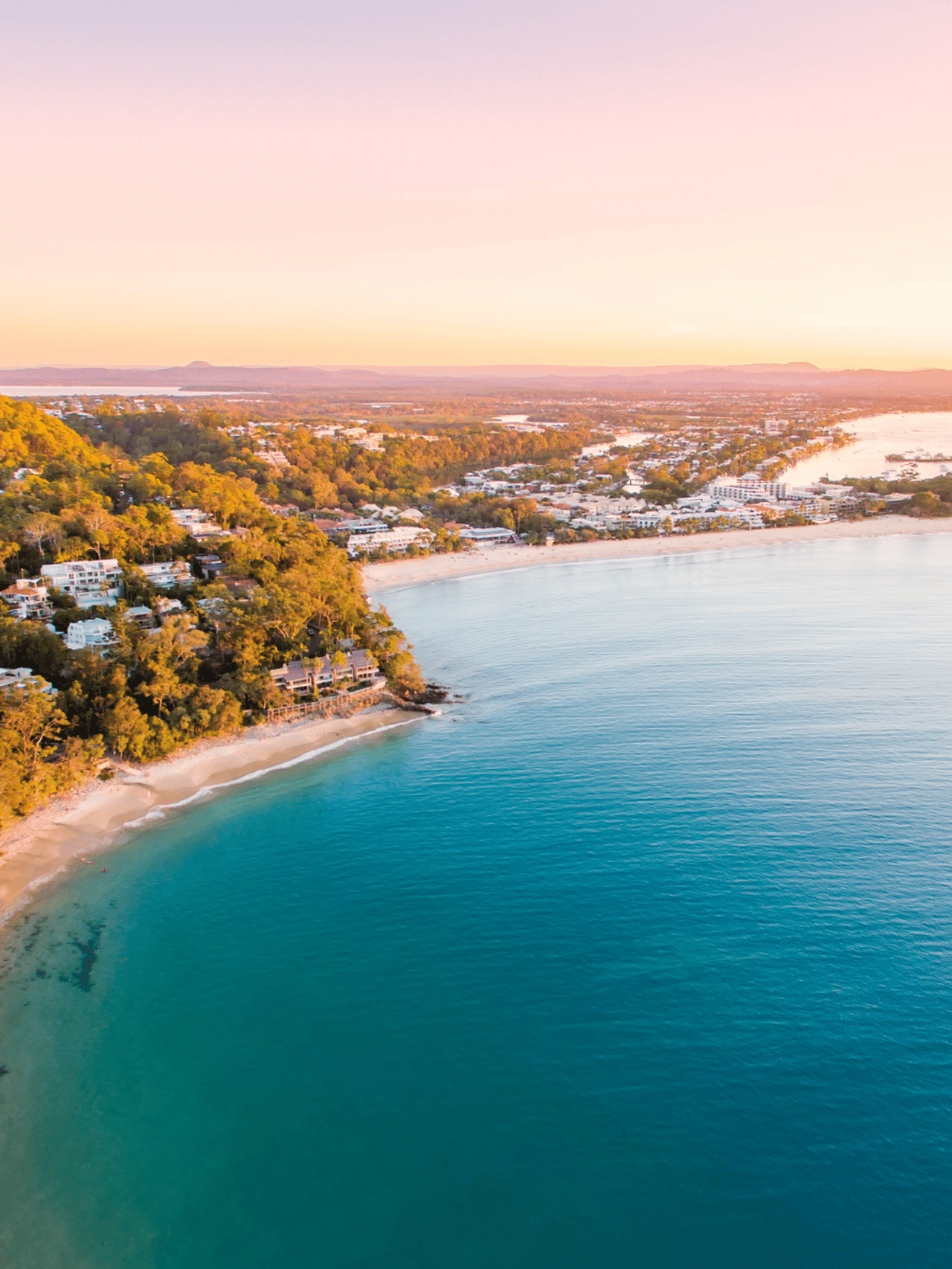 Noosa Heads National Park from an aerial perspective at sunset.