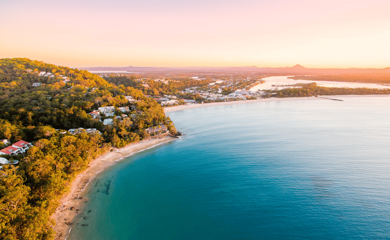 Noosa Heads National Park from an aerial perspective at sunset.