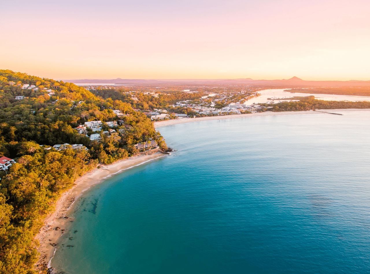Noosa Heads National Park from an aerial perspective at sunset.