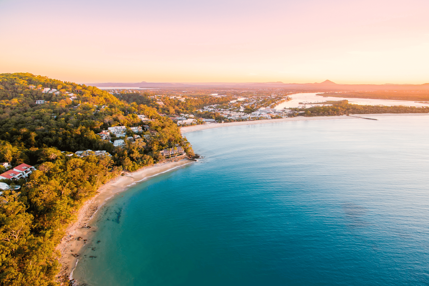 Noosa Heads National Park from an aerial perspective at sunset.