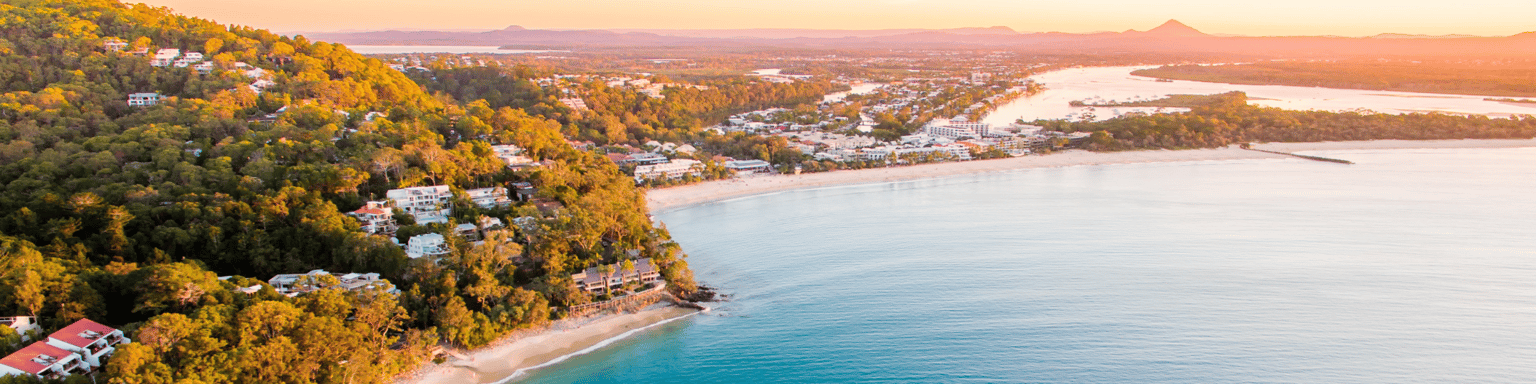 Noosa Heads National Park from an aerial perspective at sunset.