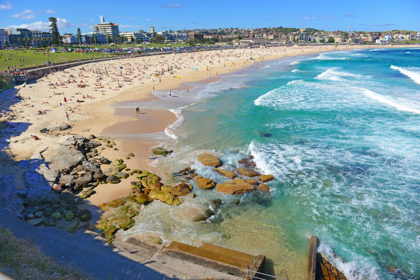 People on Bondi Beach on a sunny day.