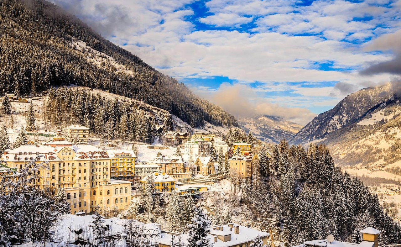 Snow on the nbuildings and trees in Bad Gastein in winter.