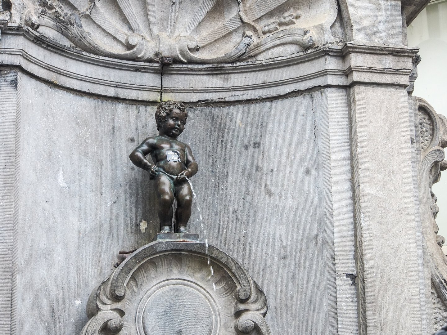 Manneken Pis (Little man Pee) or le Petit Julien, a landmark small bronze sculpture in Brussels, Belgium