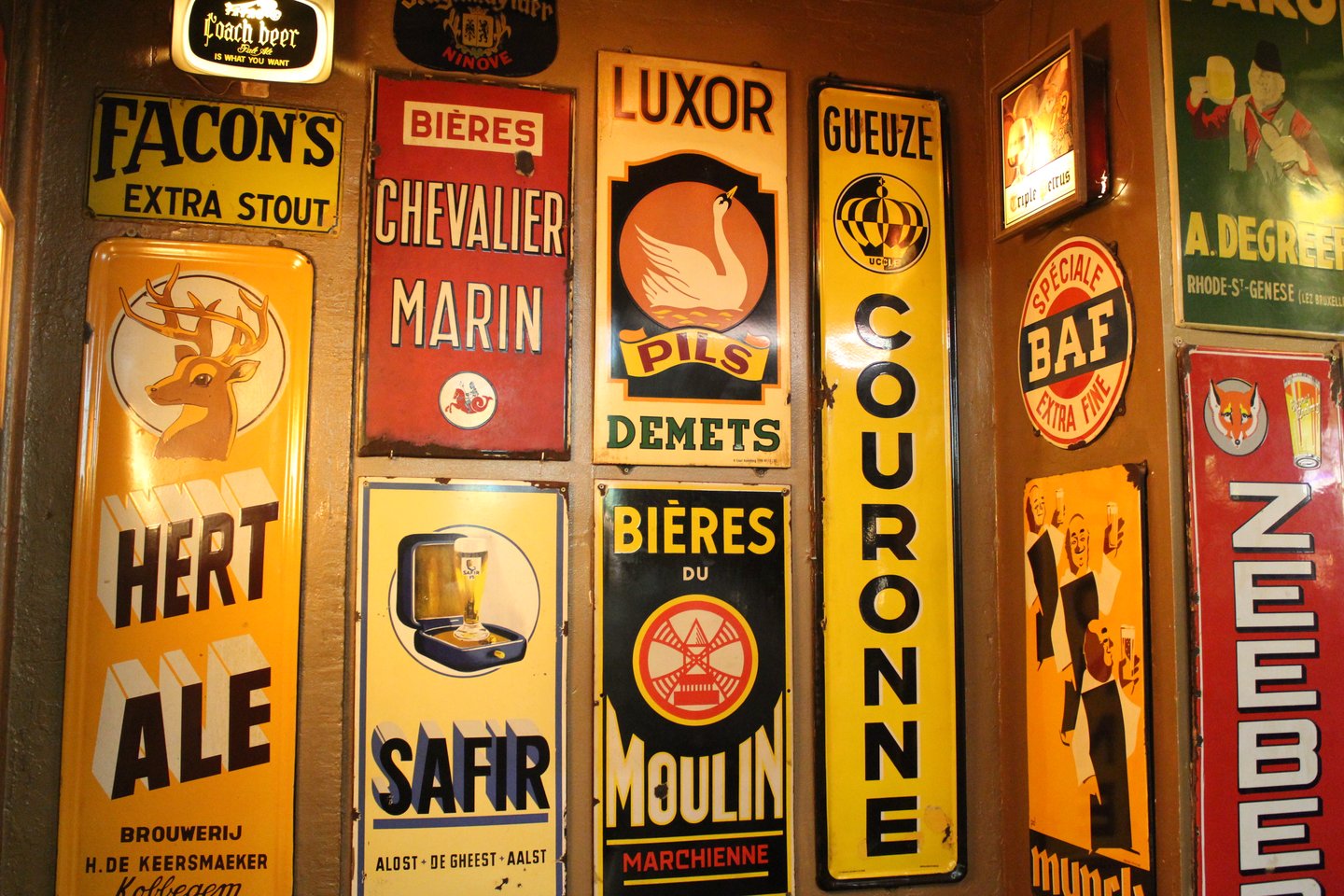 Beer logos on the wall at Delirium Cafe in Brussels
