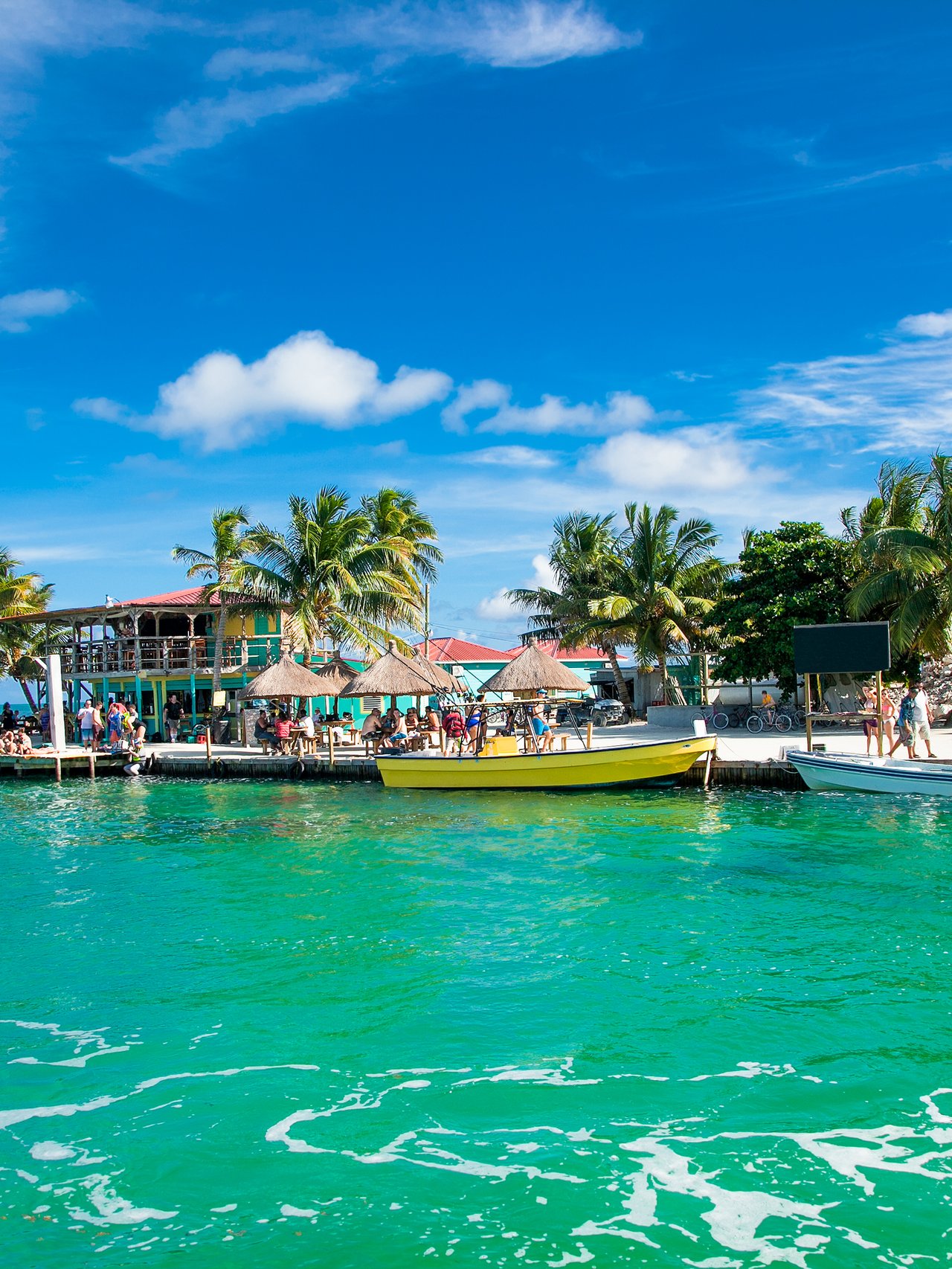 Turquoise water and small boats at Caye Caulker, Belize