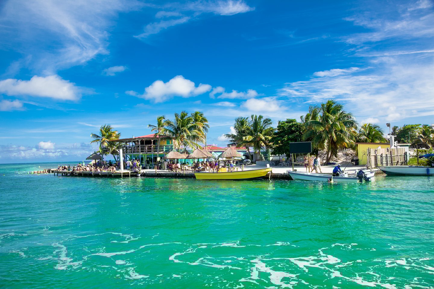 Turquoise water and small boats at Caye Caulker, Belize