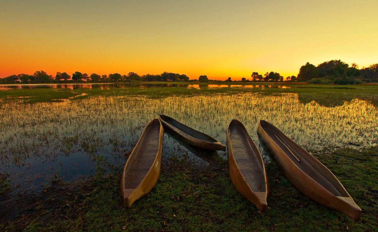 Empty mokoro on the Okavango Delta at runrise