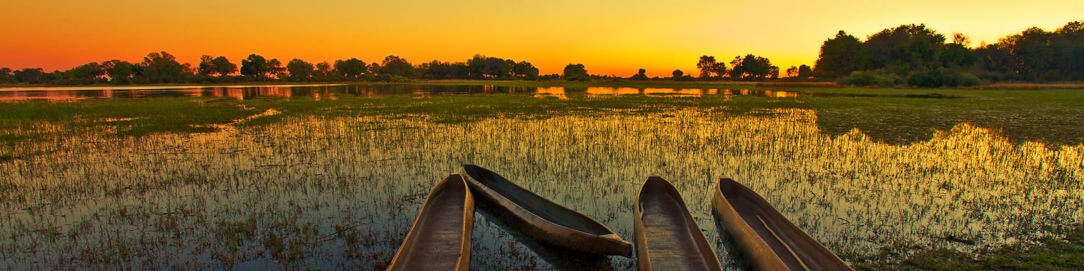 Empty mokoro on the Okavango Delta at runrise
