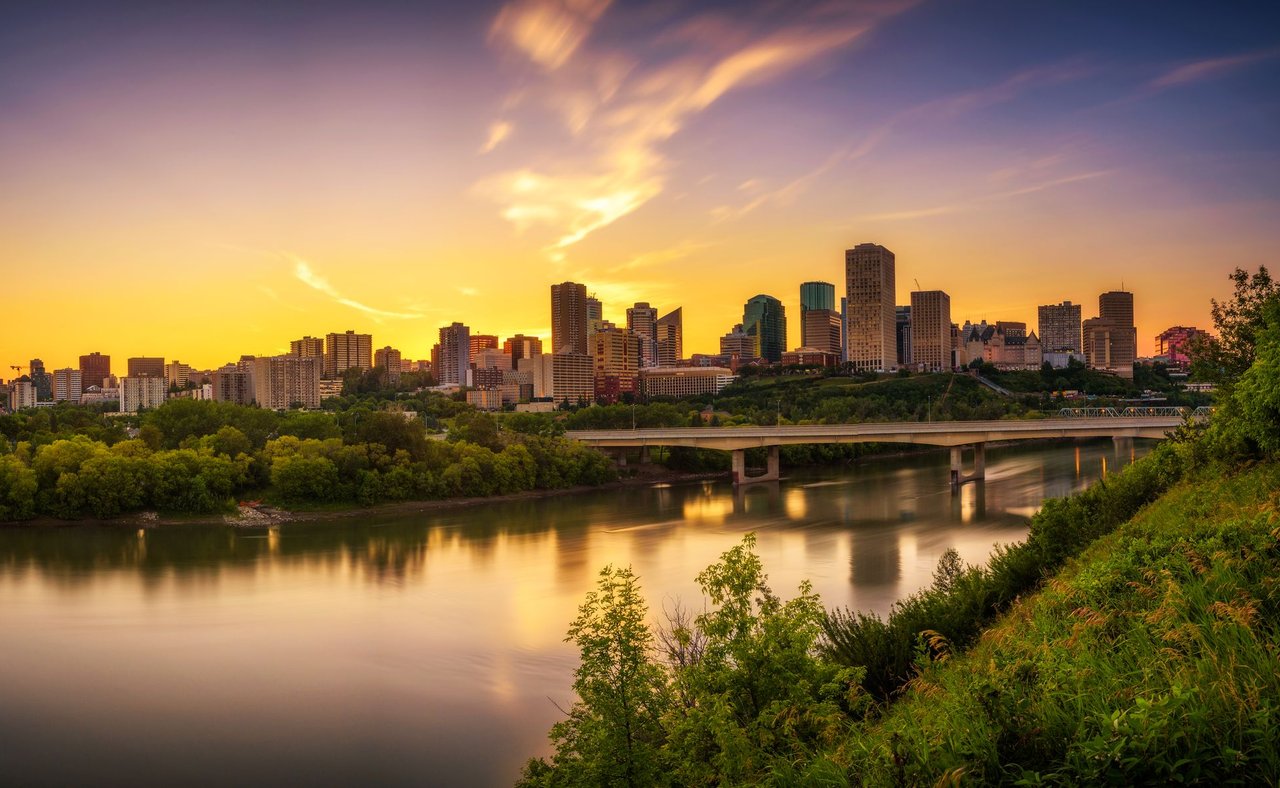 Looking at the Edmonton skyline across the river at sunset