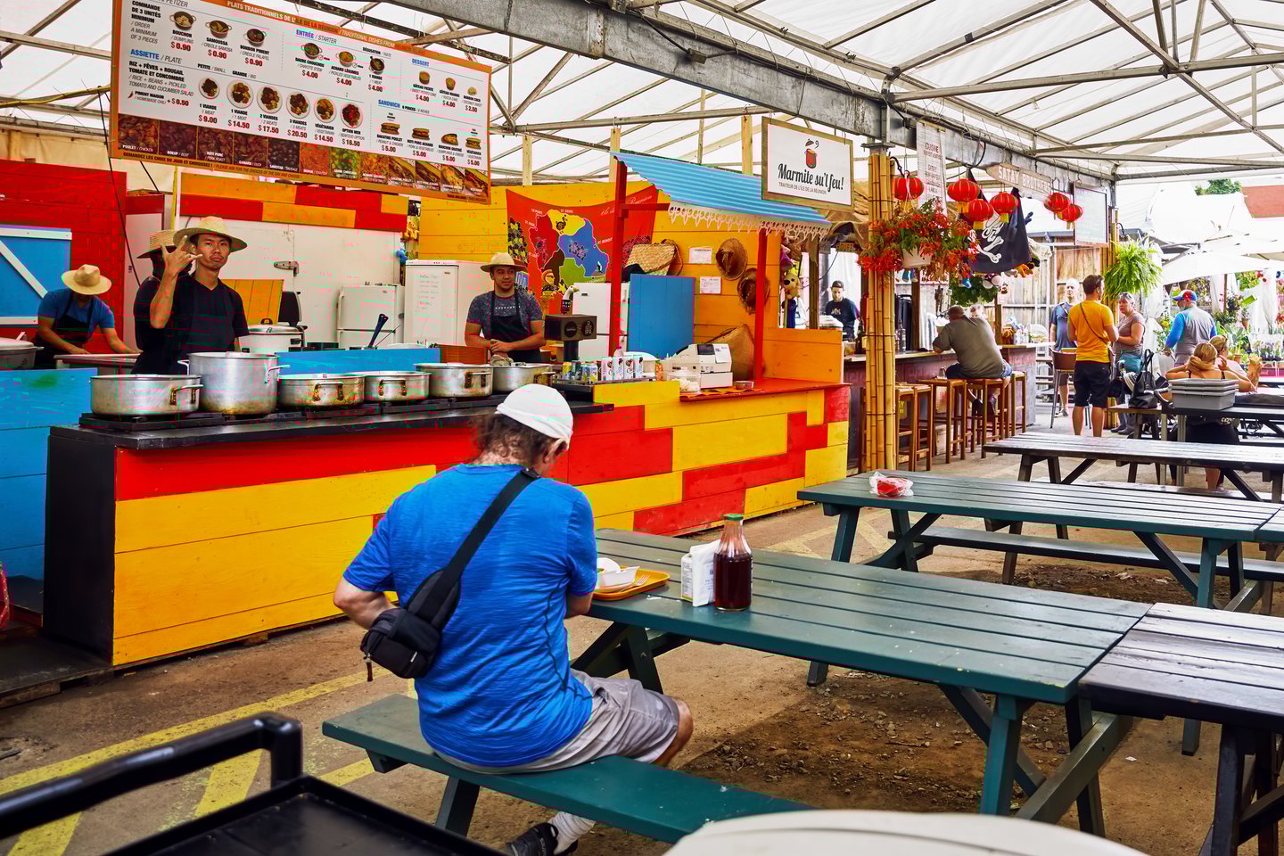 Eateries and a few customers in the Atwater Market, Montreal, Canada
