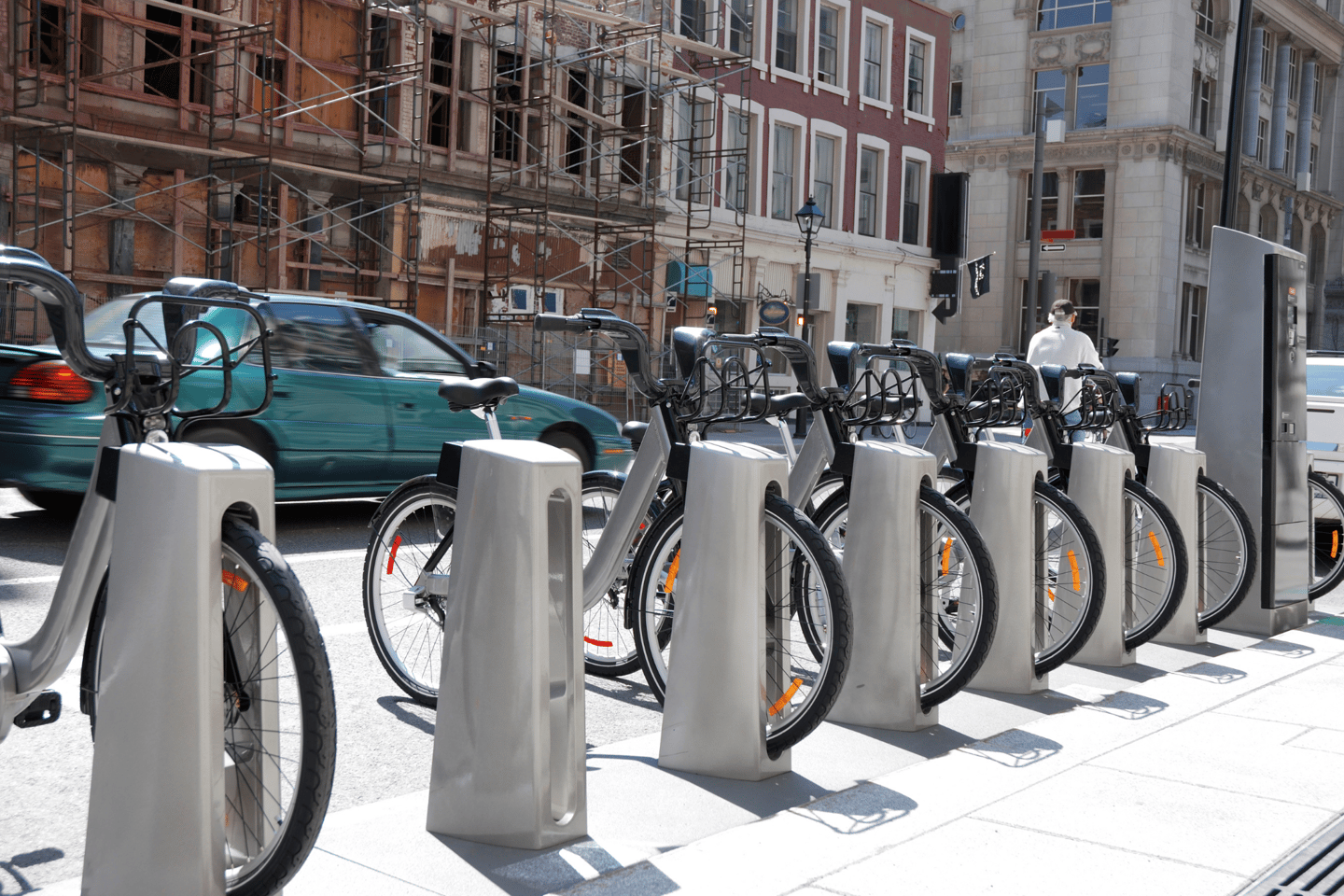 Row of Bixi bike park on street in a street in Montreal.