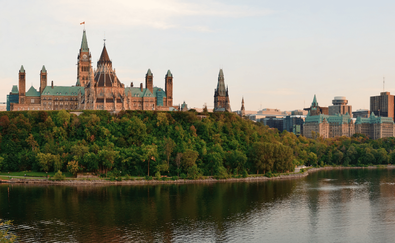 Ottawa sunset panorama over river with historical architecture