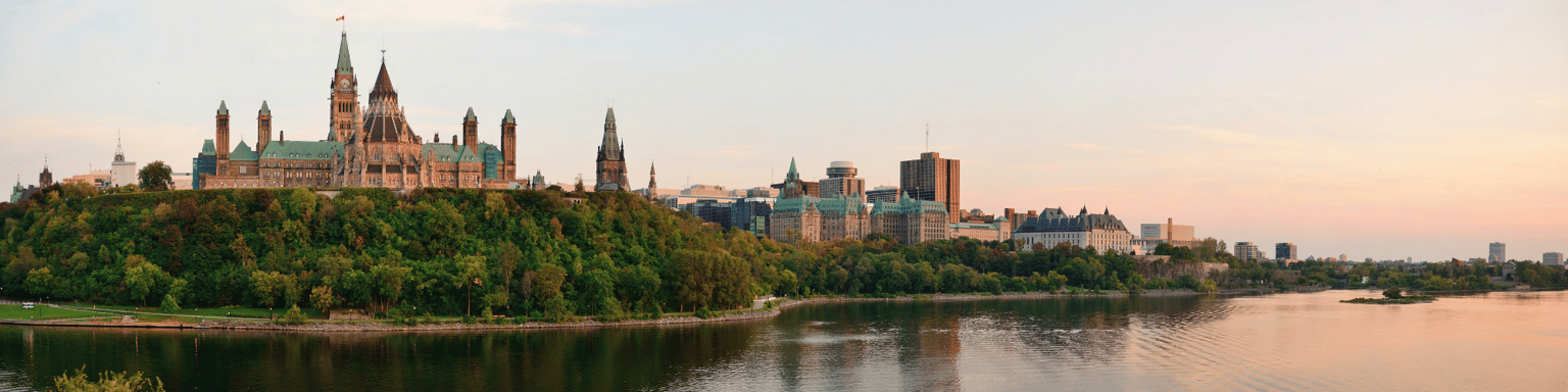 Ottawa sunset panorama over river with historical architecture