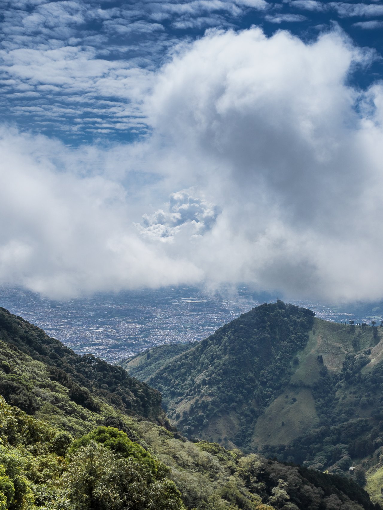 Green hills on a cloudy day in Escazu, Costa Rica.