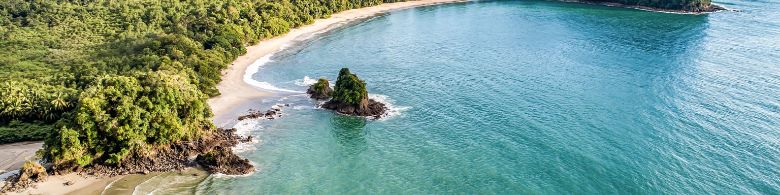 An aerial view of Espadilla Beach and the coastline near Manuel Antonio National Park