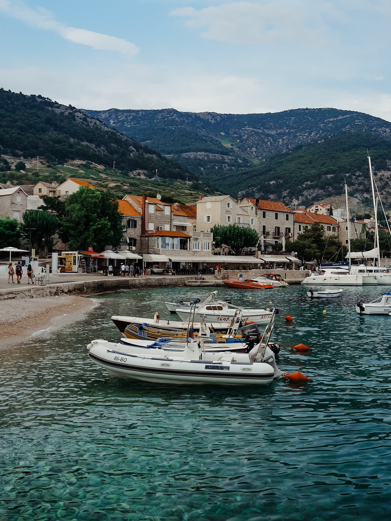 Boats bobbing at a harbour in Bol, Croatia