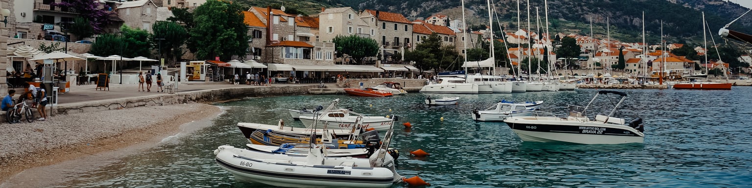 Boats bobbing at a harbour in Bol, Croatia