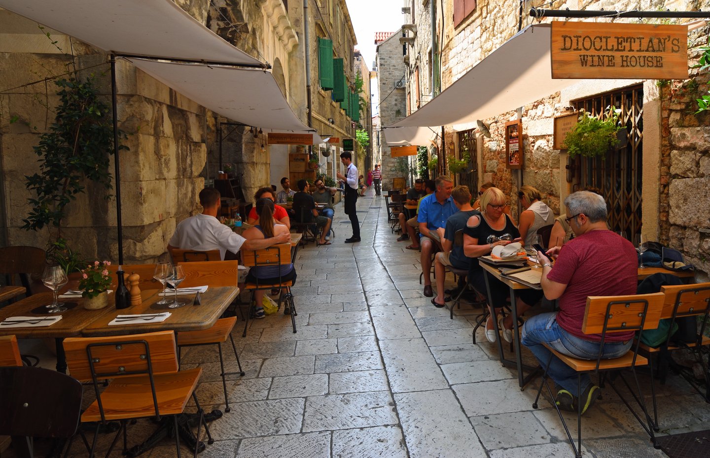 People eating in a restaurant in the walls of Diocletian Palace, Split