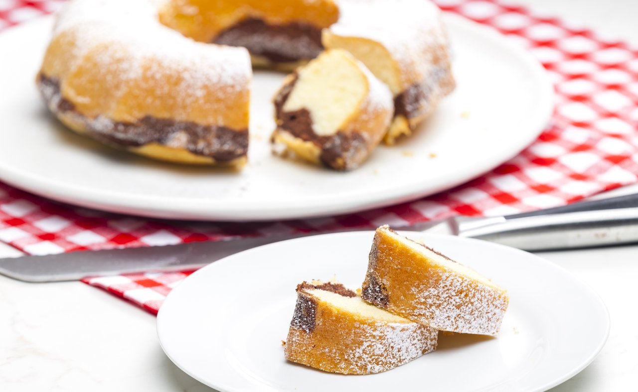 Slices of babovka with the cake in the background