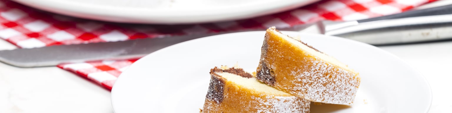 Slices of babovka with the cake in the background